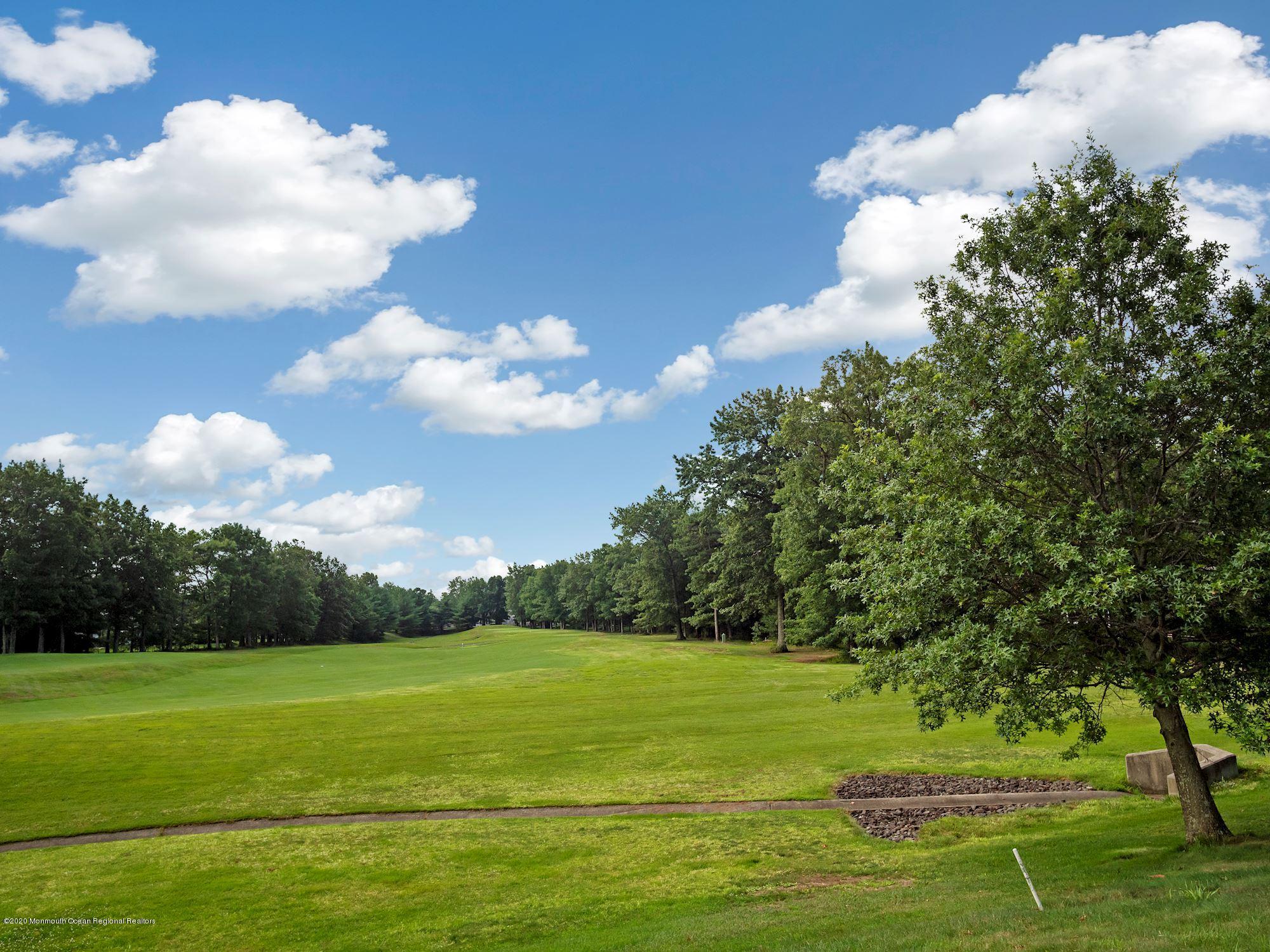 15 Winged Foot Road Jackson, NJ 08527 - Photo 11 of 34 a view of a golf course with a lake