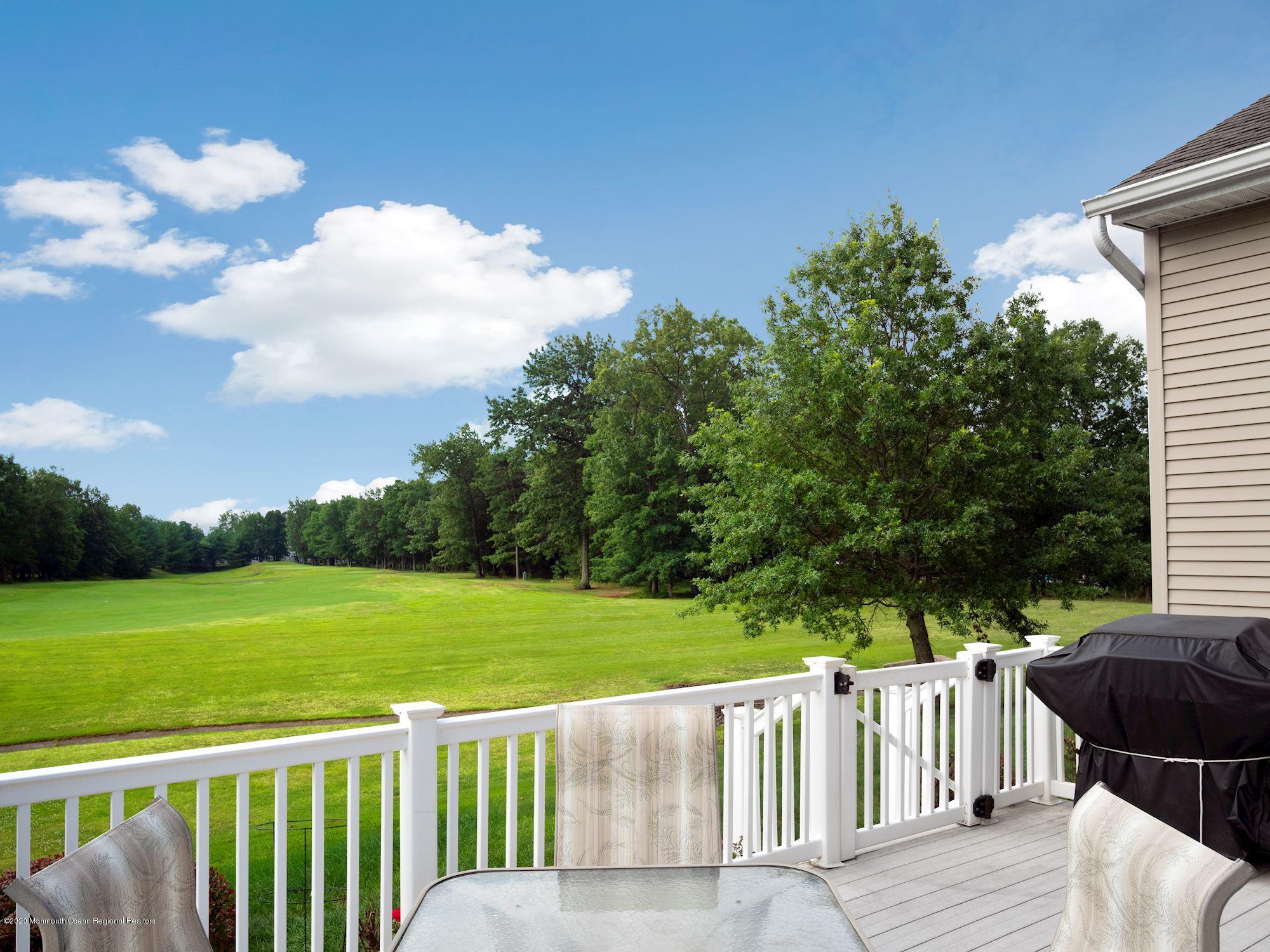 15 Winged Foot Road Jackson, NJ 08527 - Photo 13 of 34 a view of a wooden deck and a yard