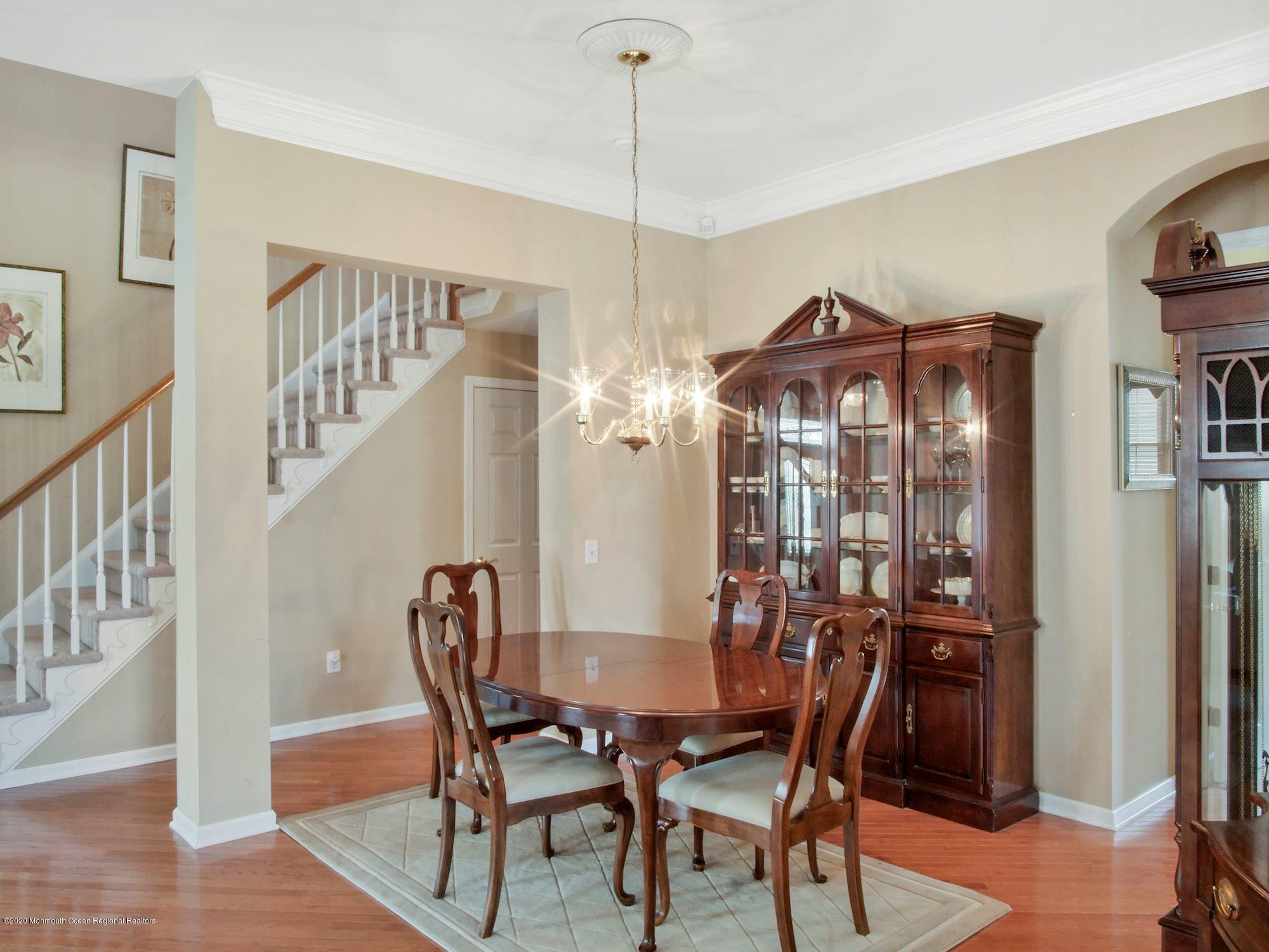 15 Winged Foot Road Jackson, NJ 08527 - Photo 17 of 34 a view of a dining room with furniture and a chandelier
