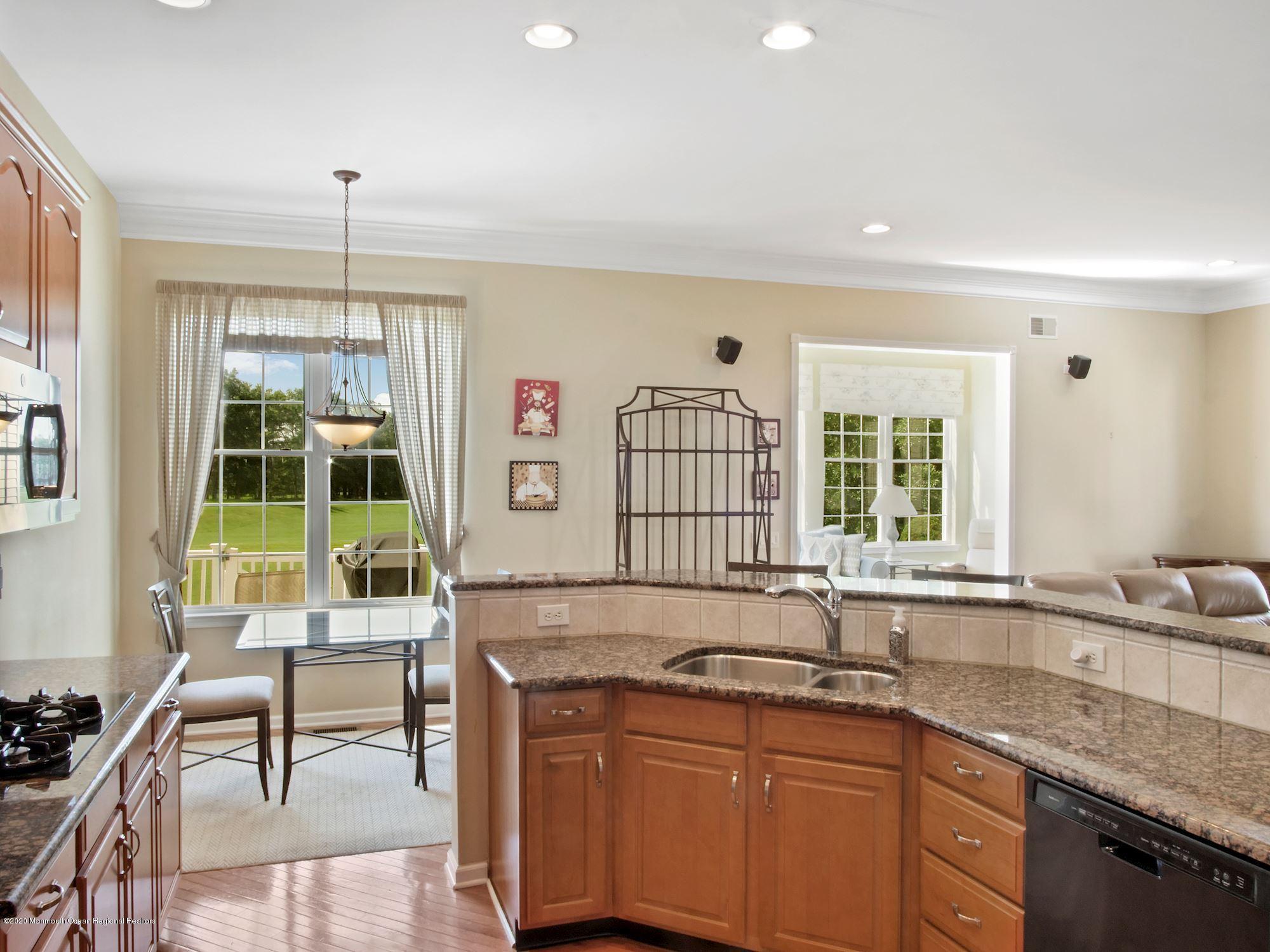 15 Winged Foot Road Jackson, NJ 08527 - Photo 18 of 34 a kitchen with a sink stove and cabinets