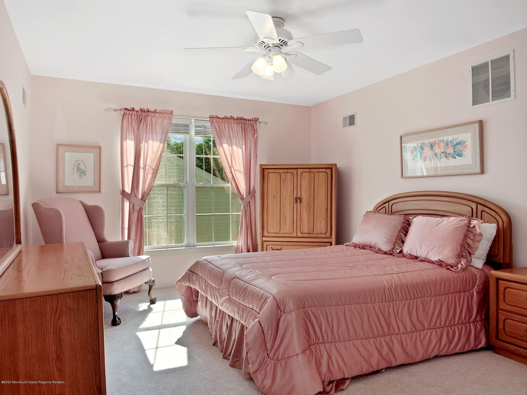 15 Winged Foot Road Jackson, NJ 08527 - Photo 24 of 34 a bedroom with a bed and a window