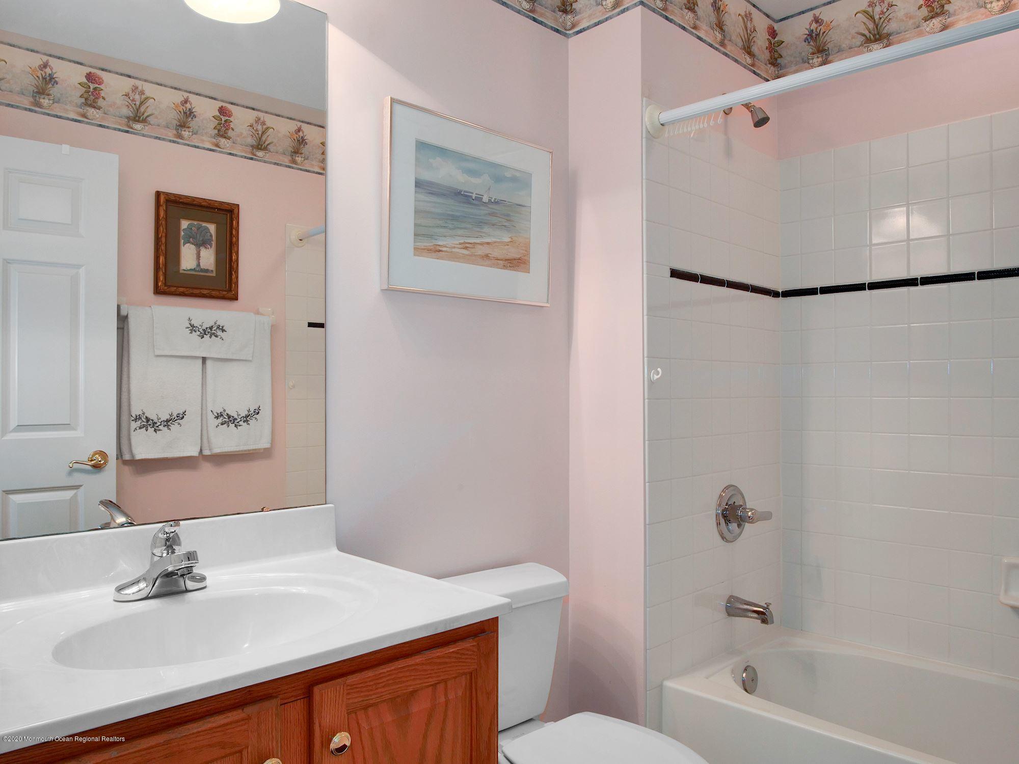 15 Winged Foot Road Jackson, NJ 08527 - Photo 30 of 34 a bathroom with a sink a toilet and shower