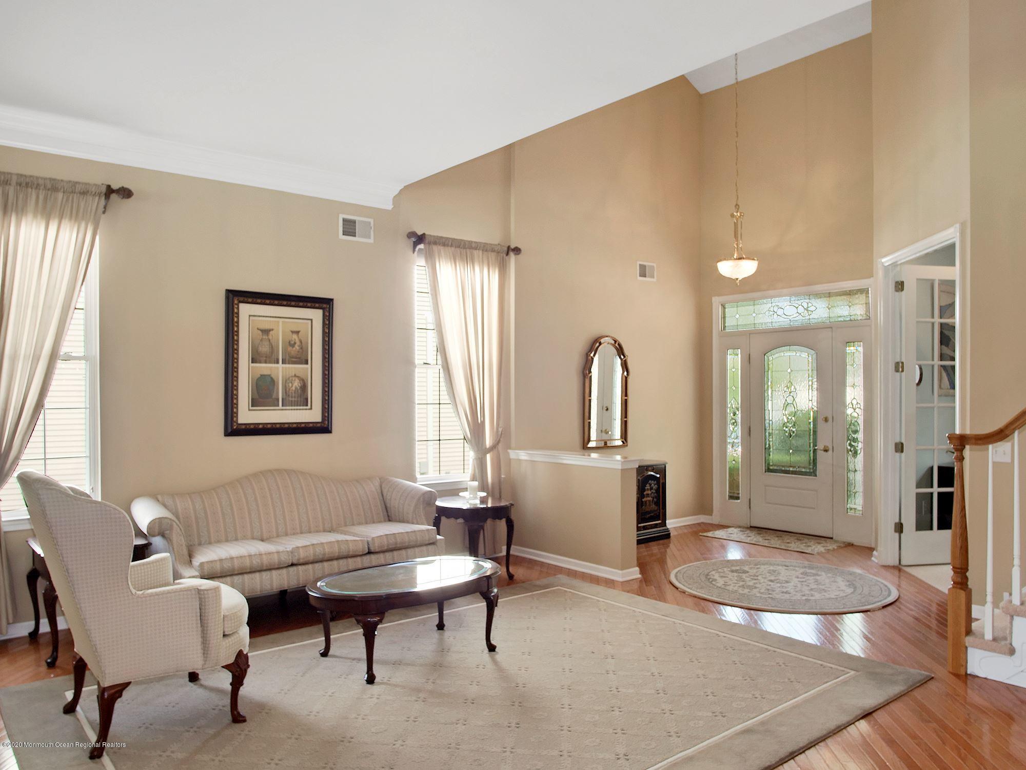 15 Winged Foot Road Jackson, NJ 08527 - Photo 3 of 34 a living room with furniture a table and a large window