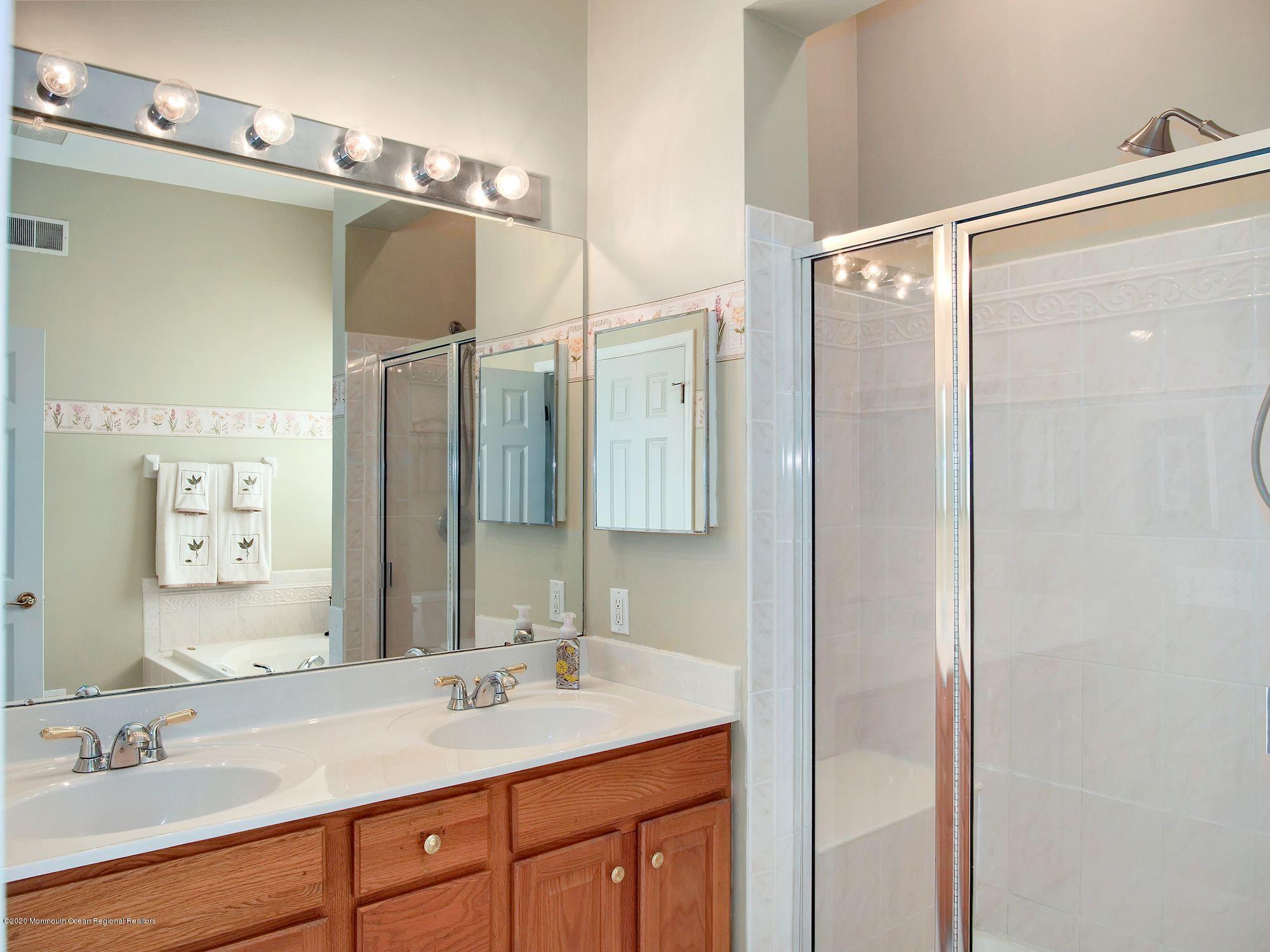 15 Winged Foot Road Jackson, NJ 08527 - Photo 31 of 34 a bathroom with a sink double vanity and a mirror