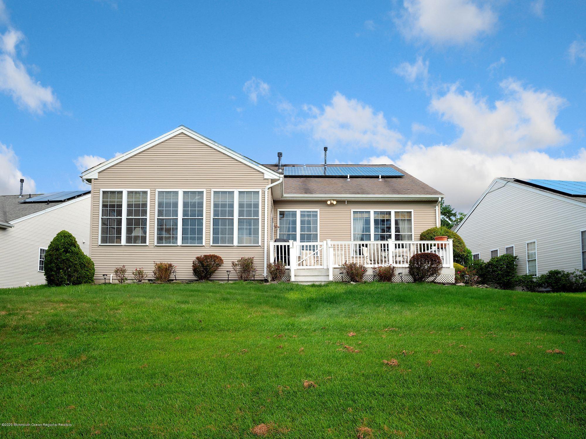 15 Winged Foot Road Jackson, NJ 08527 - Photo 32 of 34 a front view of a house with a yard porch and sitting area