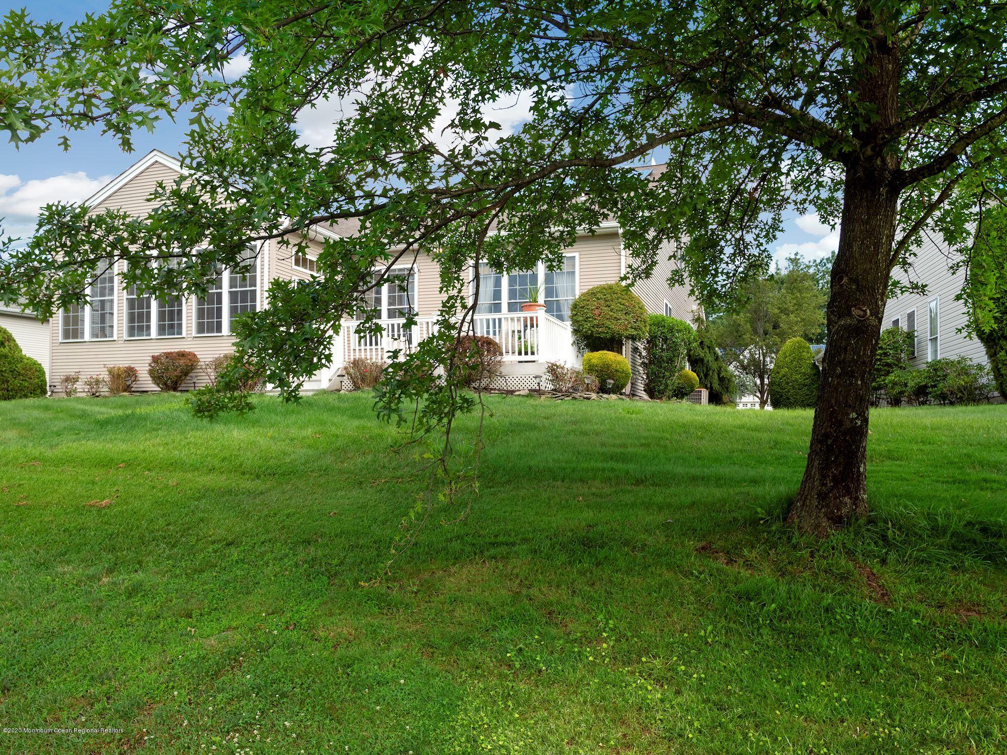 15 Winged Foot Road Jackson, NJ 08527 - Photo 34 of 34 a front view of a house with garden and trees