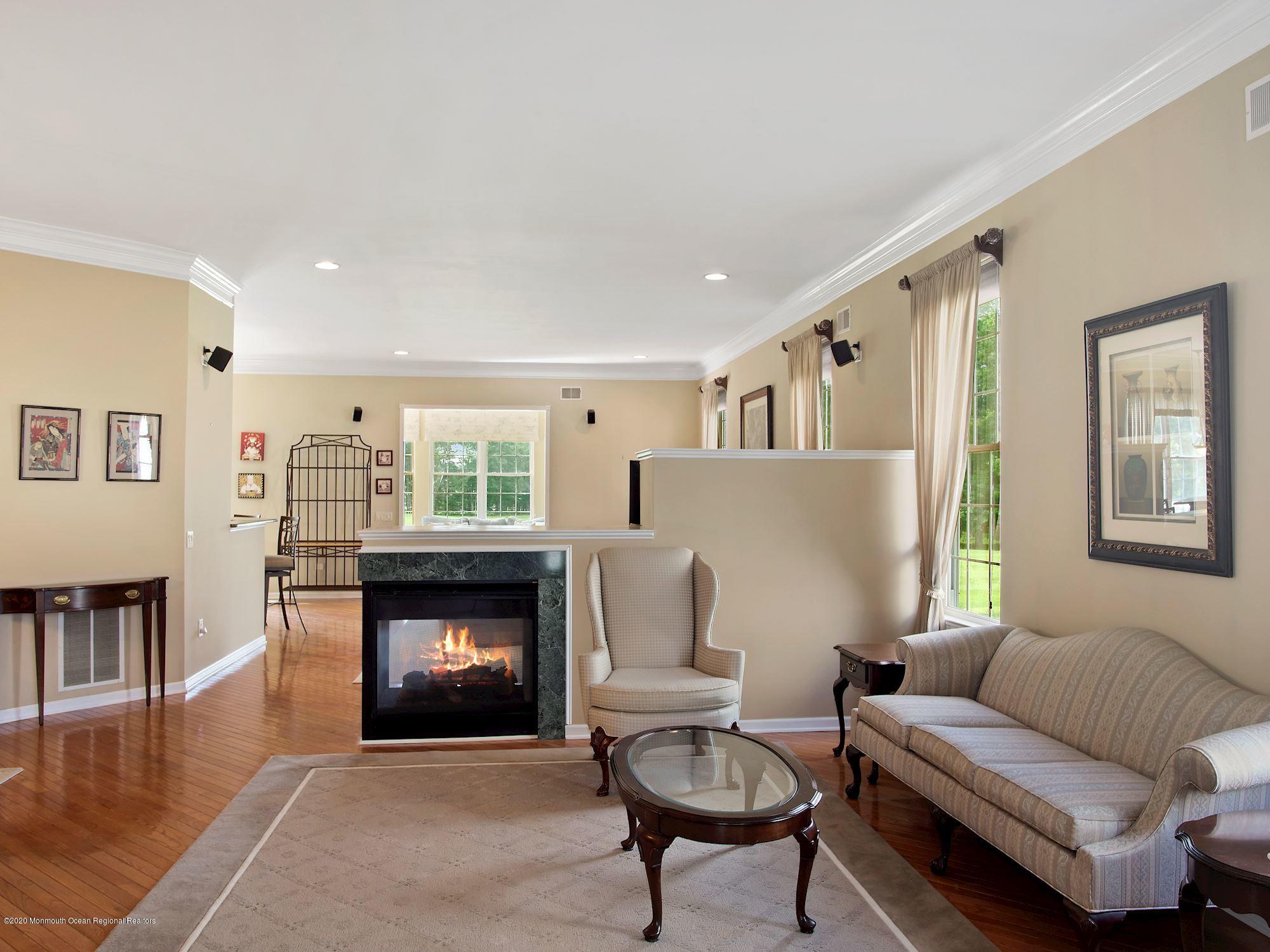15 Winged Foot Road Jackson, NJ 08527 - Photo 4 of 34 a living room with furniture and a fireplace