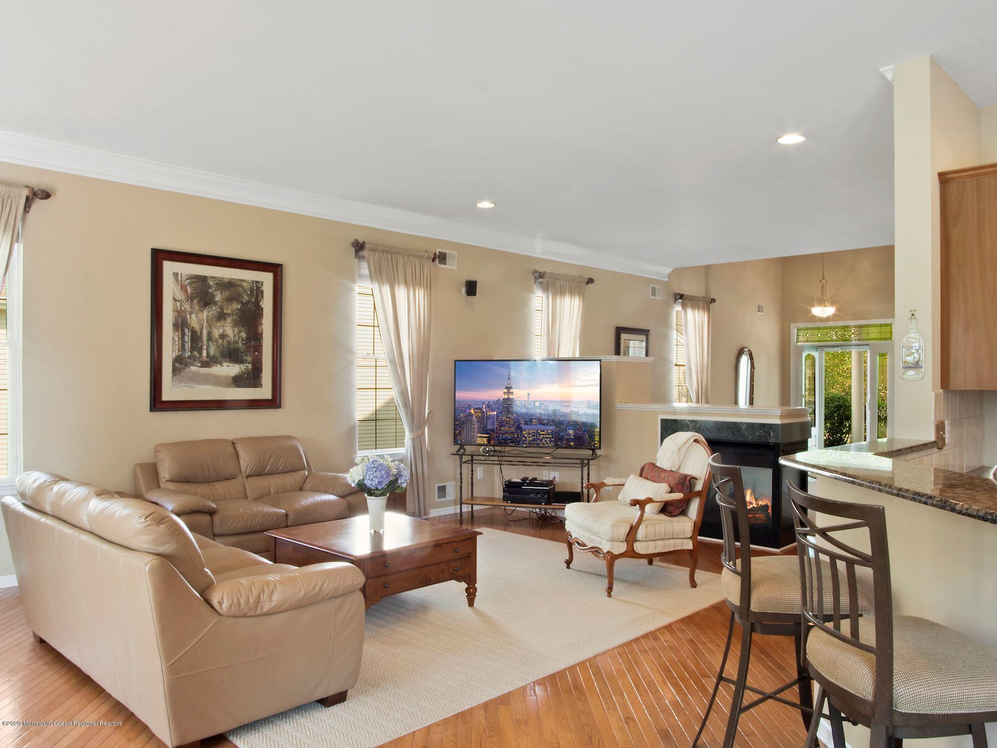 15 Winged Foot Road Jackson, NJ 08527 - Photo 5 of 34 a living room with furniture and a flat screen tv
