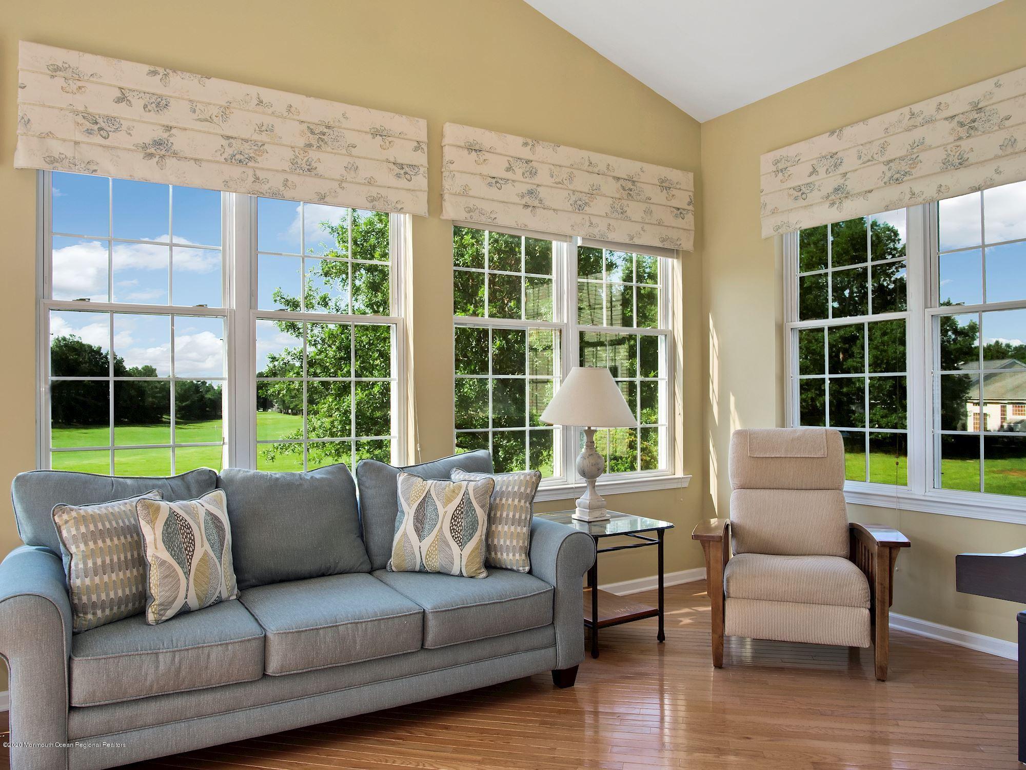 15 Winged Foot Road Jackson, NJ 08527 - Photo 8 of 34 a living room with furniture and a floor to ceiling window