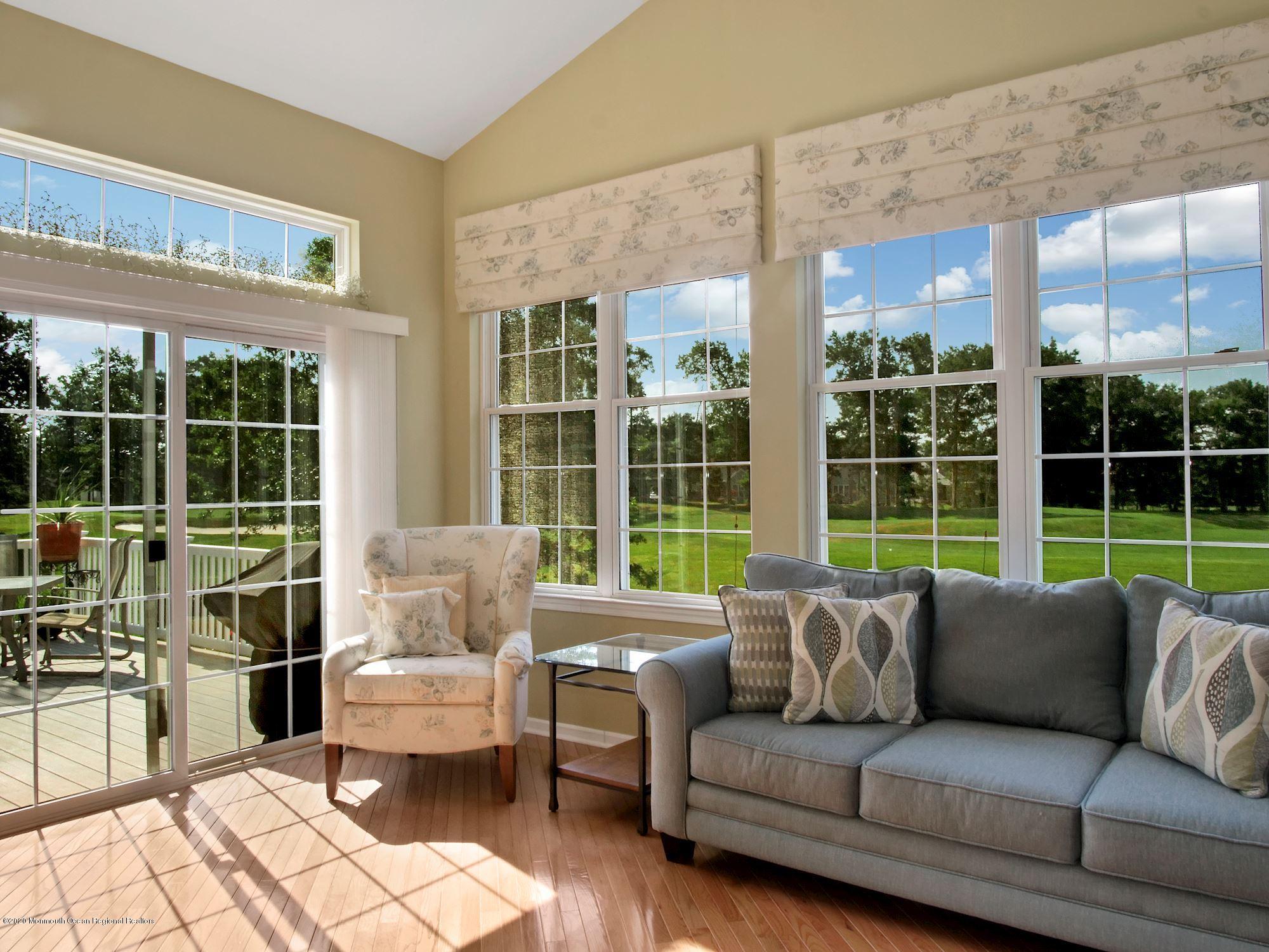 15 Winged Foot Road Jackson, NJ 08527 - Photo 9 of 34 a living room with furniture and floor to ceiling windows