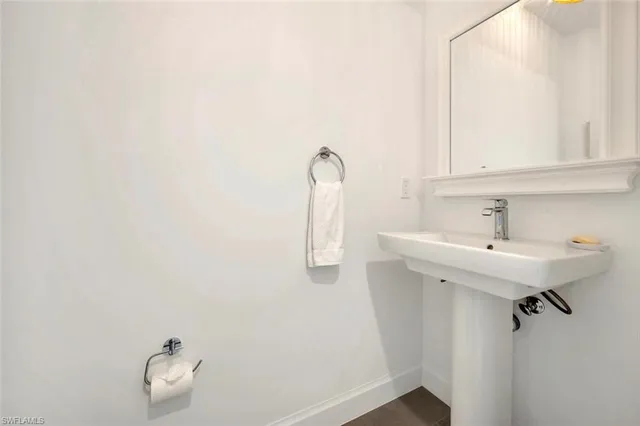 a bathroom with a sink and mirror