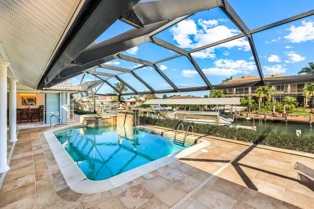 a view of a swimming pool with a patio