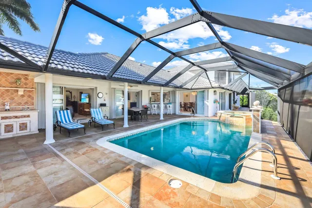 a view of a swimming pool with a patio