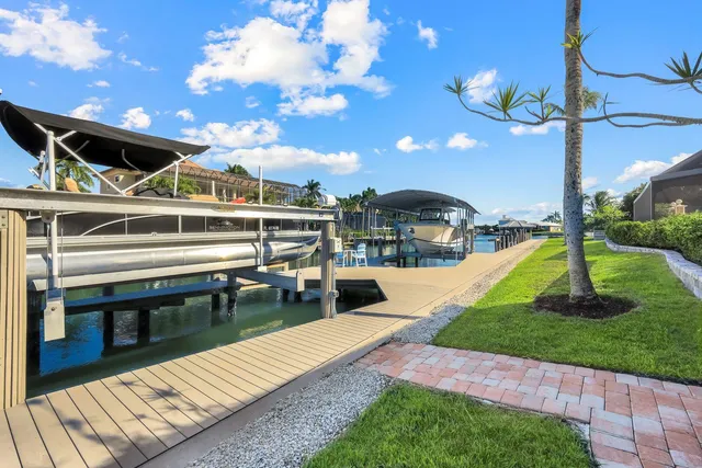 a view of a backyard with sitting area