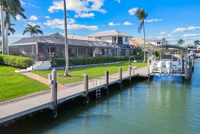 a view of an house with swimming pool yard and outdoor seating