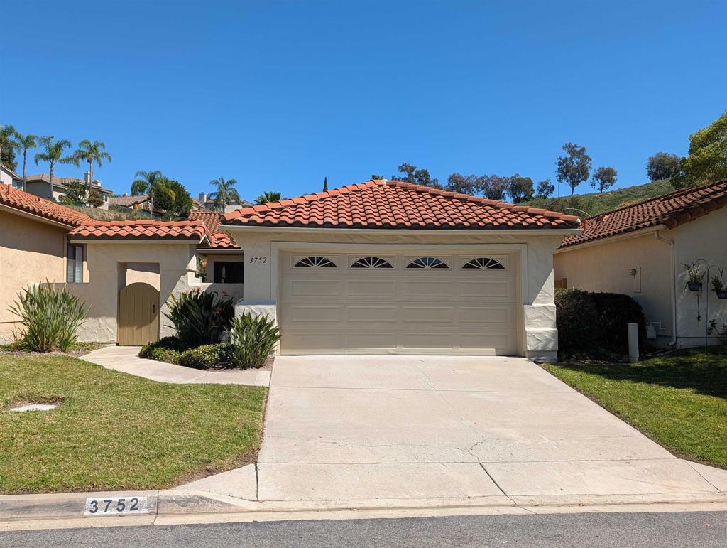 3752 Aries Escondido, CA 92025 - Photo 1 of 12 a front view of a house with a yard
