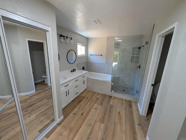 a room with a sink and a mirror