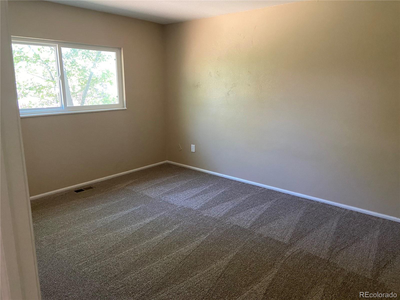 11123 Eudora Place Thornton, CO 80233 - Photo 11 of 26 an empty room with a window