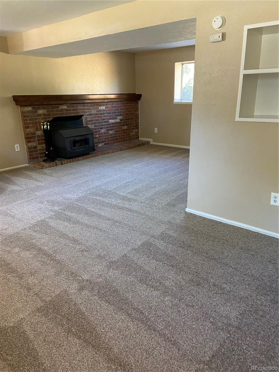 11123 Eudora Place Thornton, CO 80233 - Photo 13 of 26 a car parked in a room