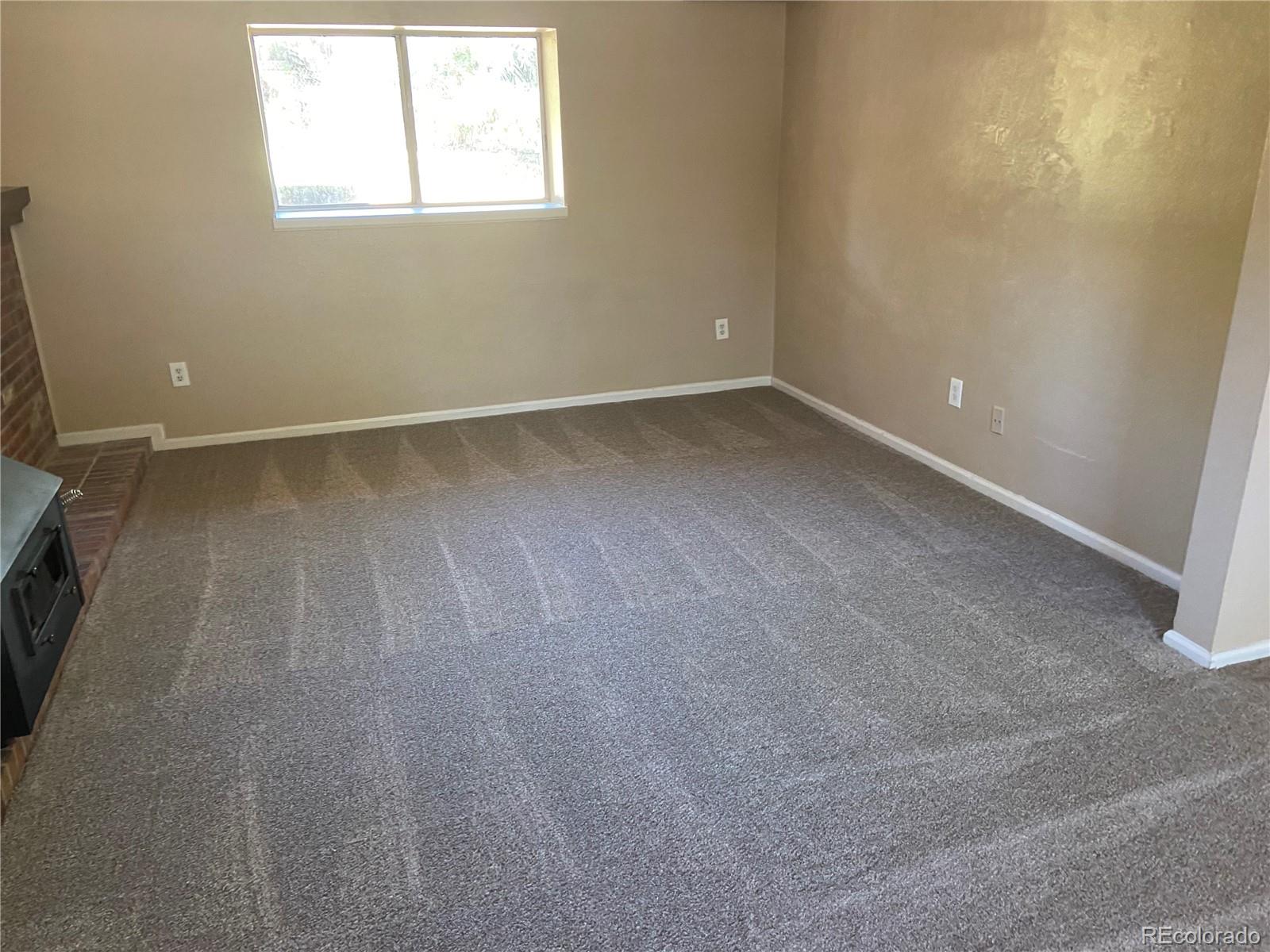 11123 Eudora Place Thornton, CO 80233 - Photo 14 of 26 an empty room with a window