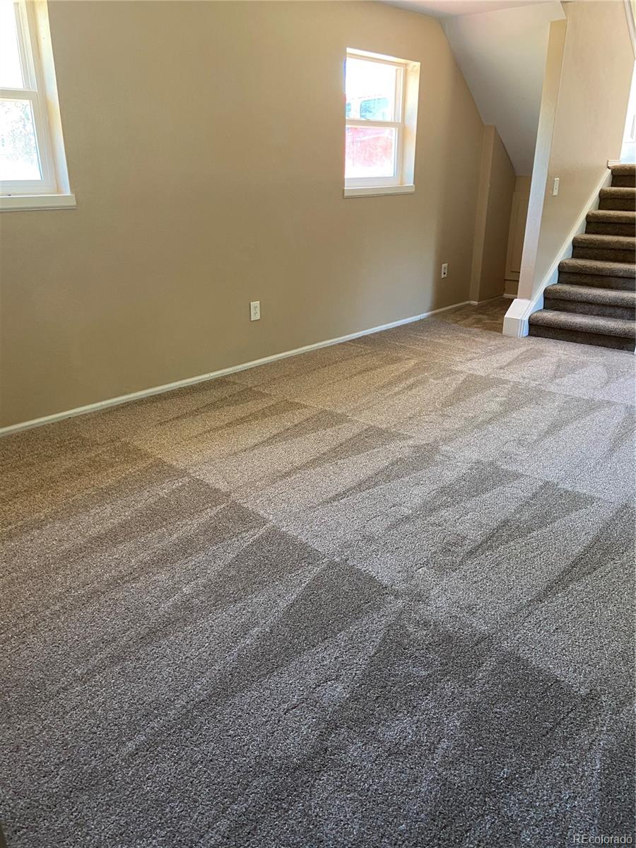 11123 Eudora Place Thornton, CO 80233 - Photo 15 of 26 a view of an empty room with stairs
