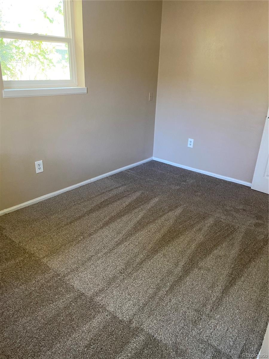 11123 Eudora Place Thornton, CO 80233 - Photo 21 of 26 an empty room with a window