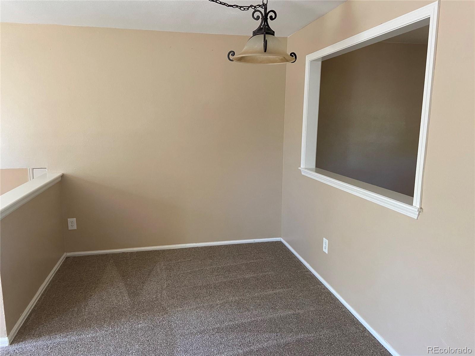 11123 Eudora Place Thornton, CO 80233 - Photo 4 of 26 a view of small space with racks on the wall