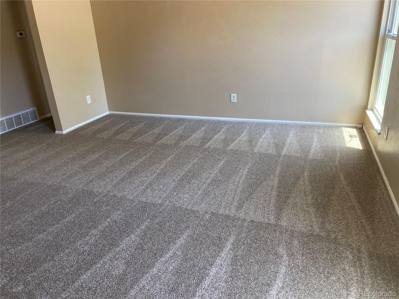 11123 Eudora Place Thornton, CO 80233 - Photo 6 of 26 a view of an empty room and window