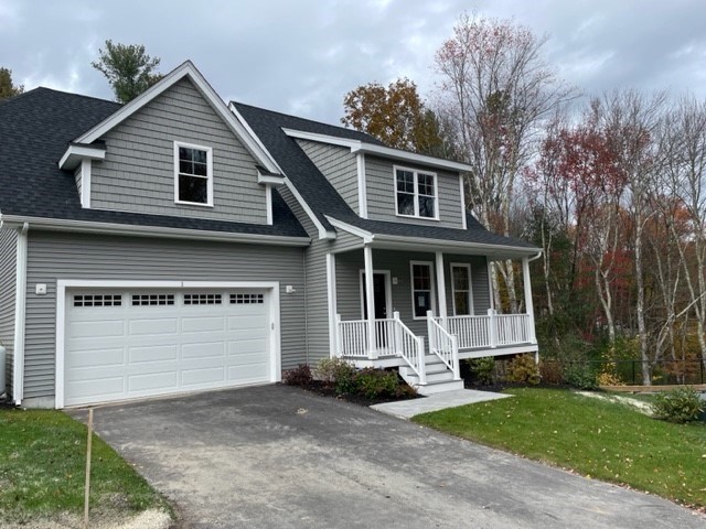 1 Shoemaker Lane, Unit 1 Upton, MA 01568 - Photo 1 of 6 a front view of a house with a garage