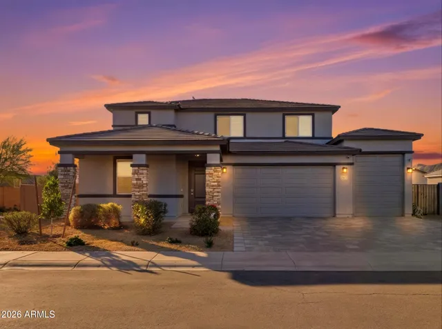 an aerial view of a houses with a city street