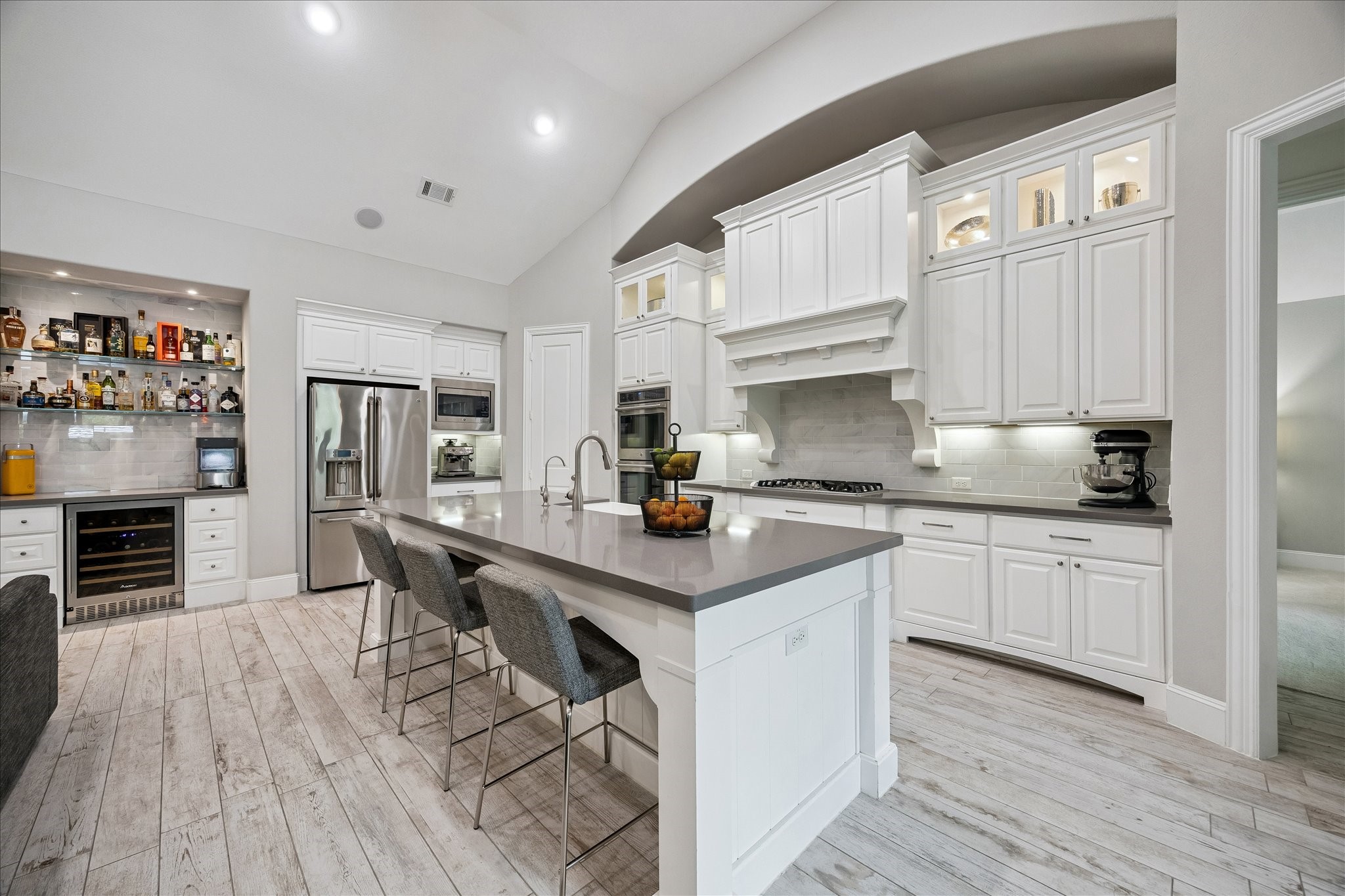 2807 Mayfield Ridge Lane Katy, TX 77494 - Photo 14 of 50 a kitchen with stainless steel appliances granite countertop a stove a sink dishwasher and a refrigerator with wooden floor
