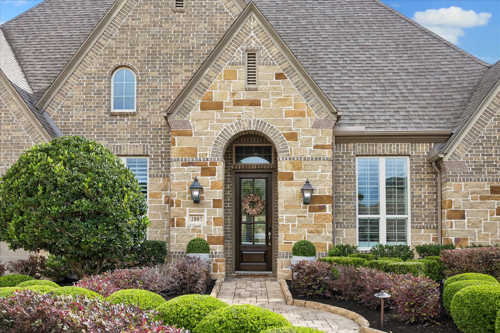 2807 Mayfield Ridge Lane Katy, TX 77494 - Photo 2 of 50 a front view of a house with garden