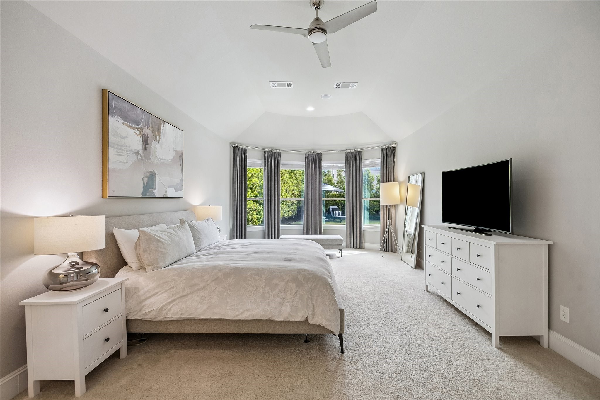 2807 Mayfield Ridge Lane Katy, TX 77494 - Photo 21 of 50 a spacious bedroom with a bed and a flat screen tv
