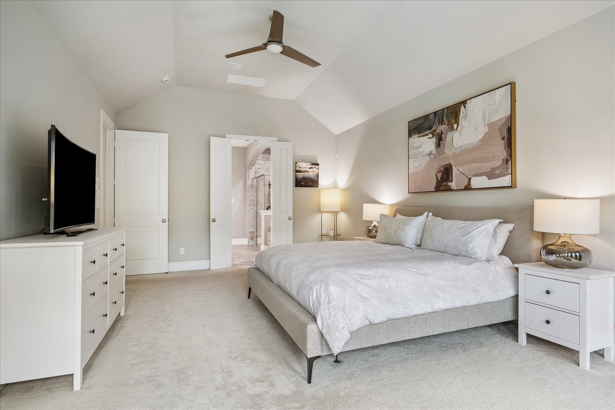 2807 Mayfield Ridge Lane Katy, TX 77494 - Photo 22 of 50 a spacious bedroom with a bed and a flat screen tv