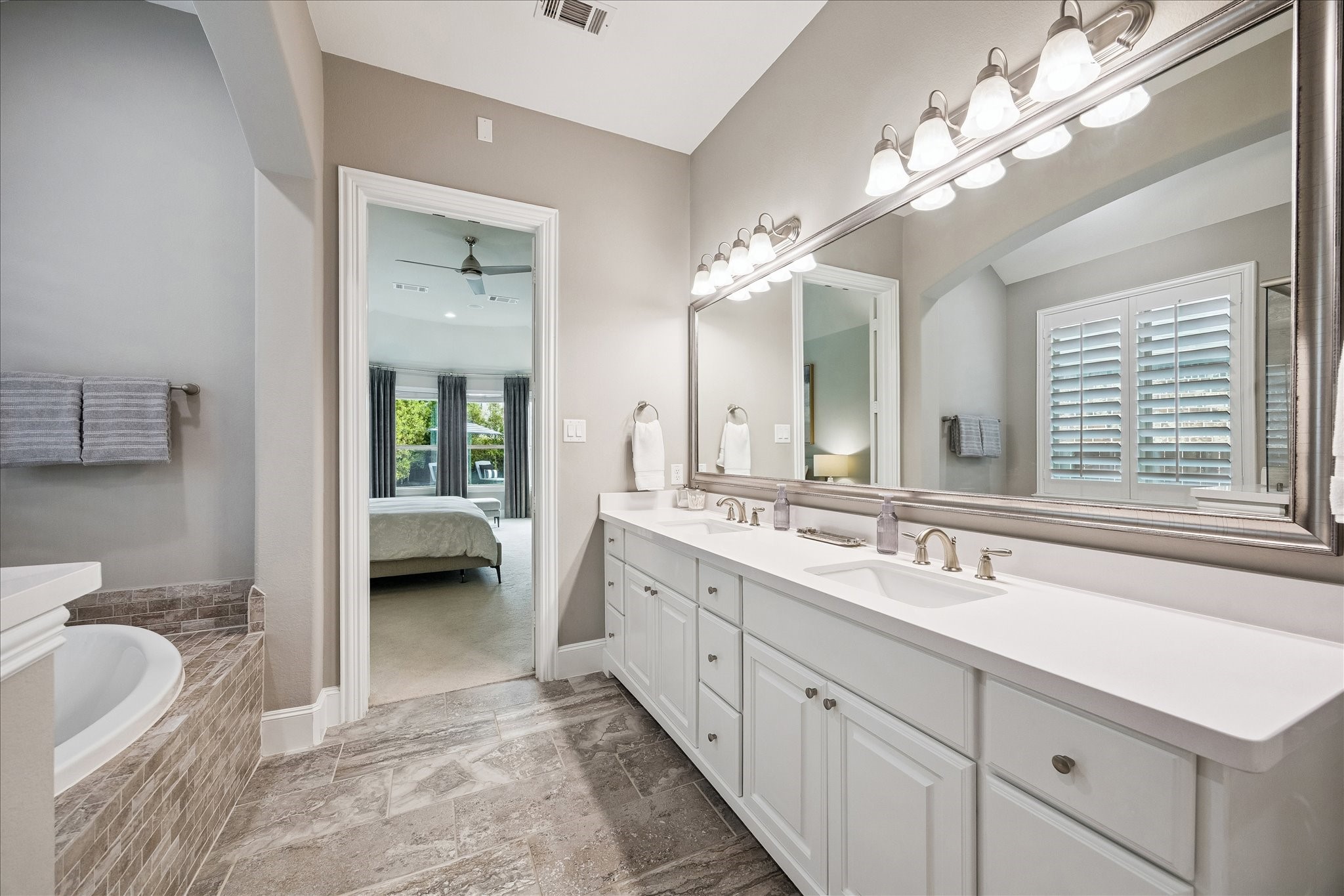 2807 Mayfield Ridge Lane Katy, TX 77494 - Photo 25 of 50 a spacious en suite bathroom with double sink and a mirror