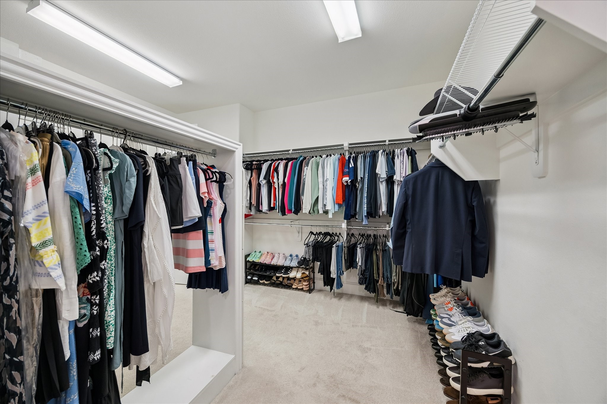2807 Mayfield Ridge Lane Katy, TX 77494 - Photo 26 of 50 a view of walk in closet with clothes and shoes