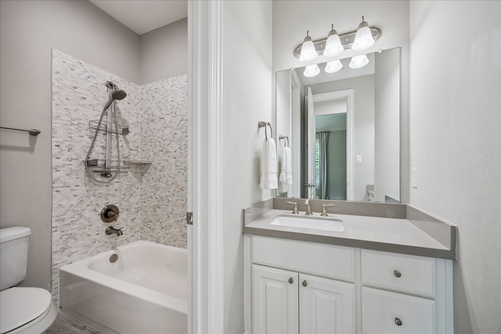 2807 Mayfield Ridge Lane Katy, TX 77494 - Photo 32 of 50 a bathroom with a bathtub shower sink and mirror