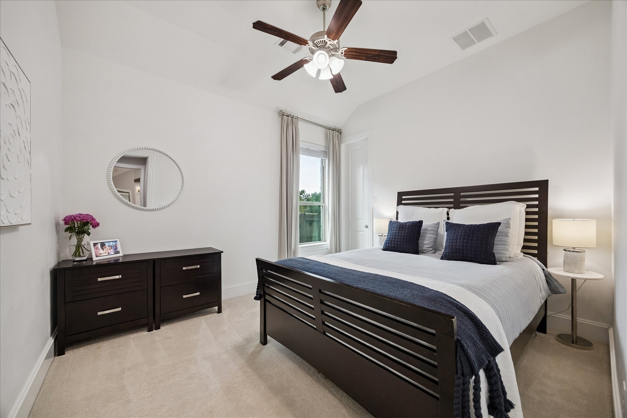 2807 Mayfield Ridge Lane Katy, TX 77494 - Photo 36 of 50 a bedroom with a bed and a chandelier