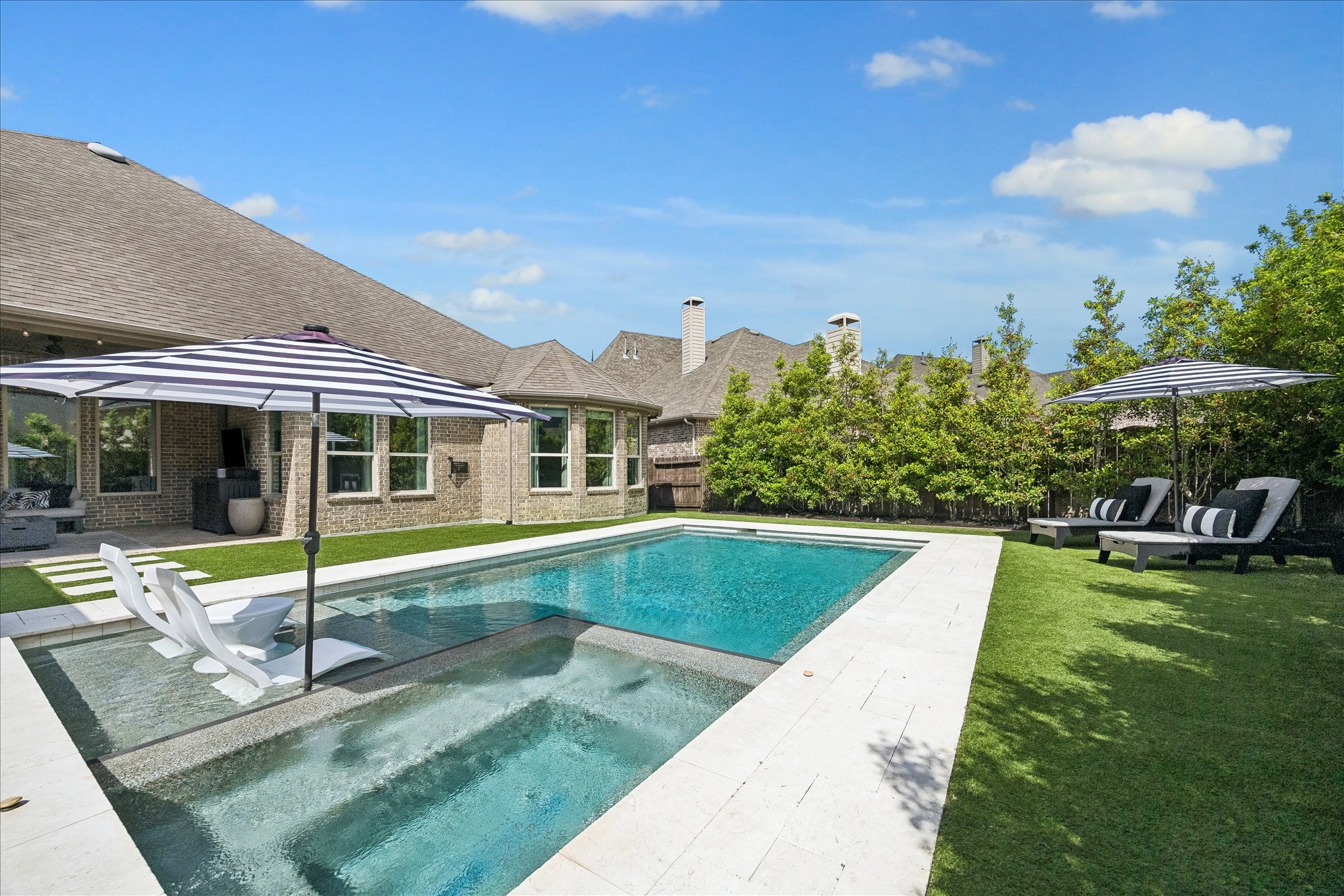 2807 Mayfield Ridge Lane Katy, TX 77494 - Photo 46 of 50 a view of pool with lawn chairs and large trees