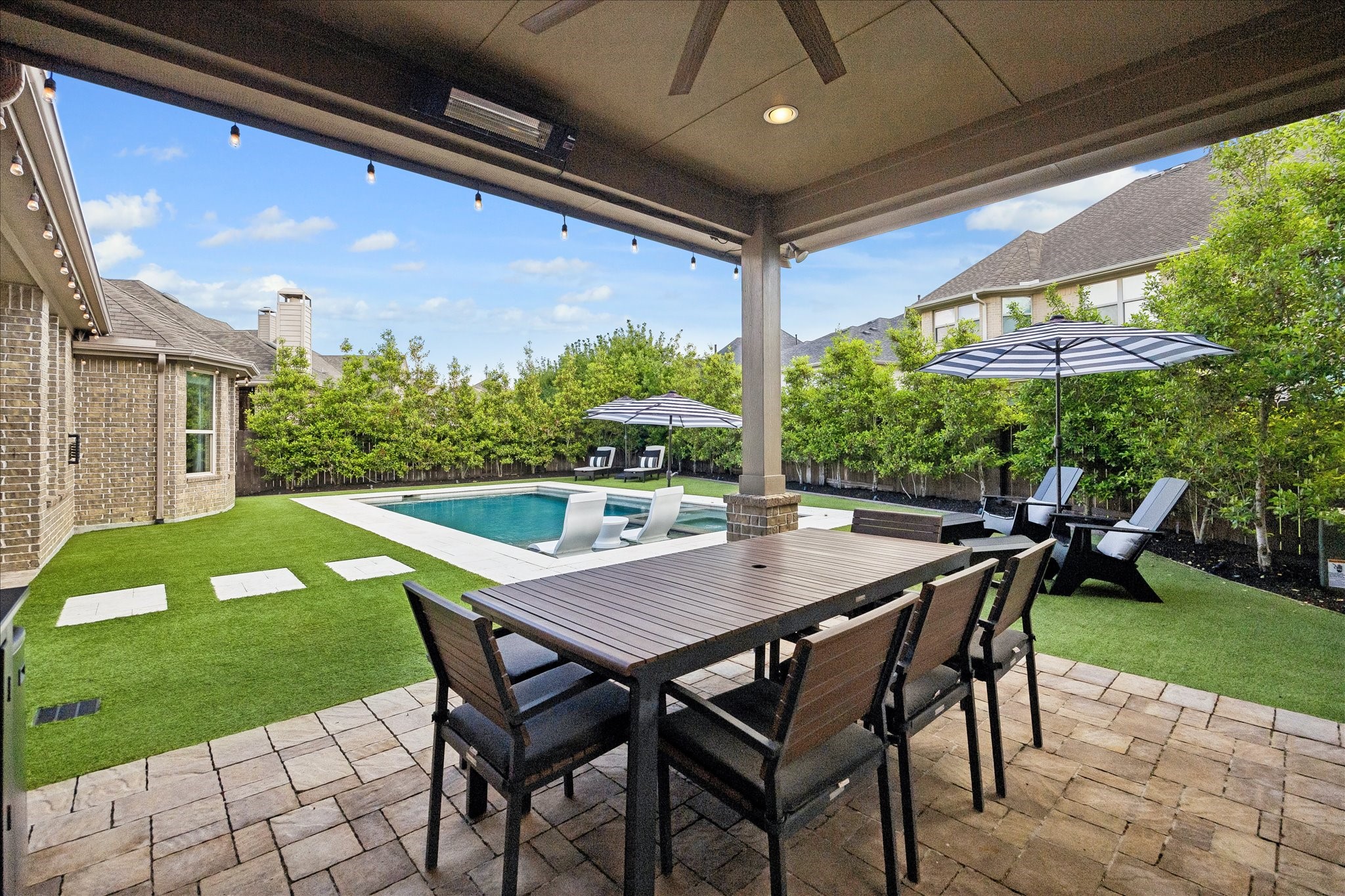 2807 Mayfield Ridge Lane Katy, TX 77494 - Photo 48 of 50 a view of an outdoor dining space with a table and chairs