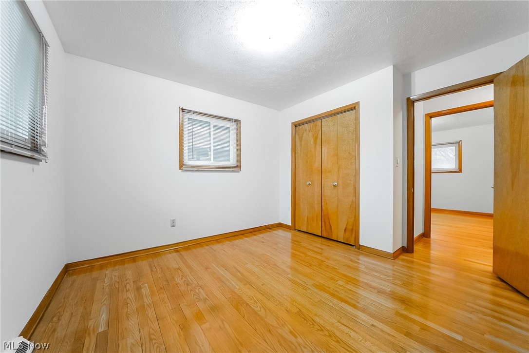 4801 Roadoan Road Cleveland, OH 44144 - Photo 11 of 28 Master bedroom with wood floors and private half bath