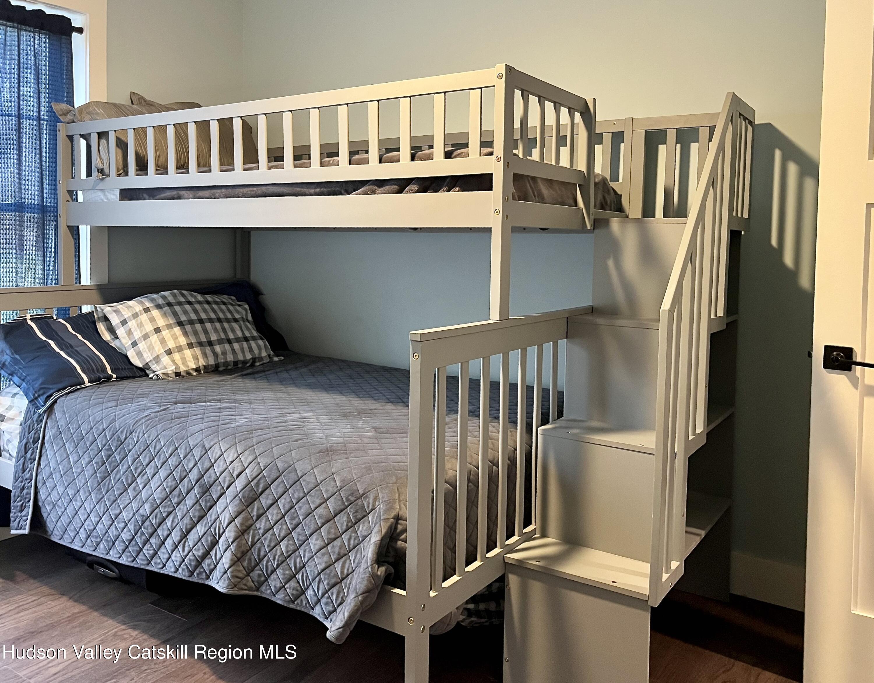 685 Sandy Plains Road Athens, NY 12451 - Photo 15 of 37 a bedroom with a bed and a window