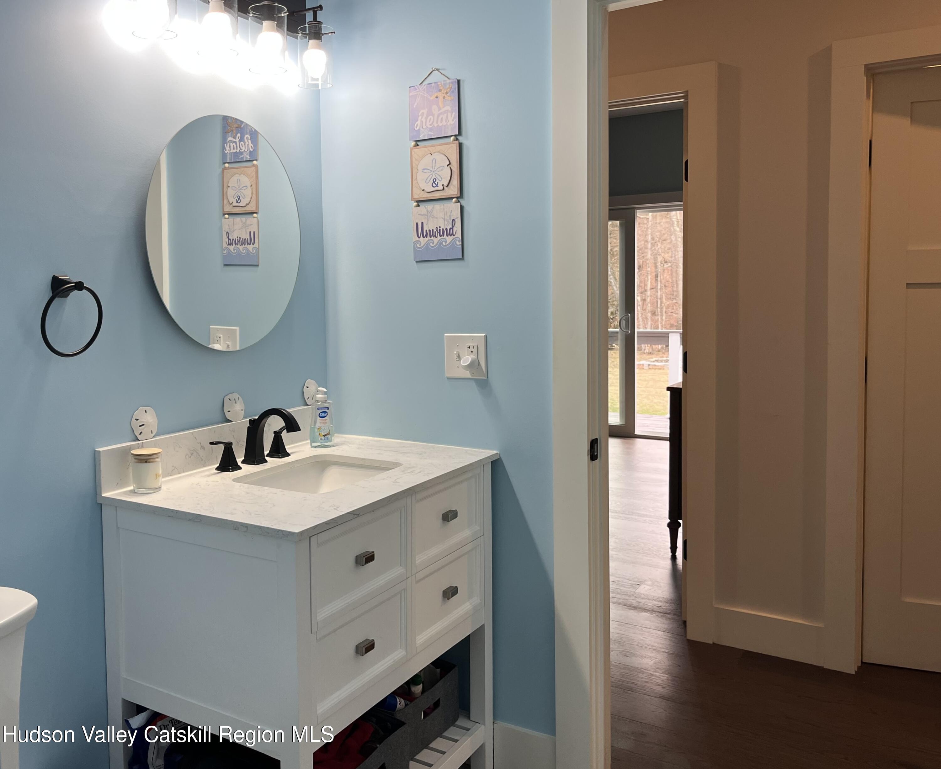 685 Sandy Plains Road Athens, NY 12451 - Photo 17 of 37 a bathroom with a sink and a mirror