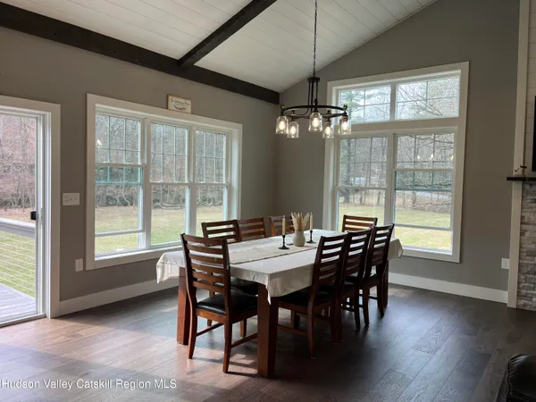 a view of a dining room with furniture window and outside view