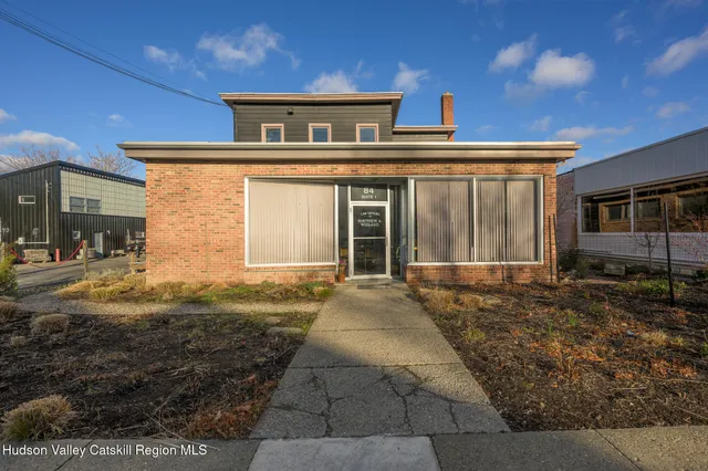 a very nice looking living room with furniture and a large window