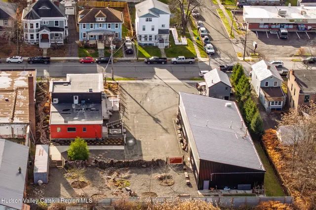 an aerial view of multiple houses with outdoor space