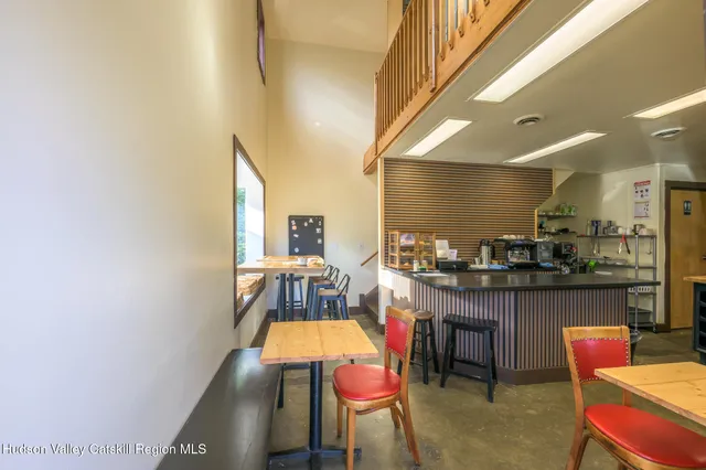 a bedroom with furniture and a wooden floor