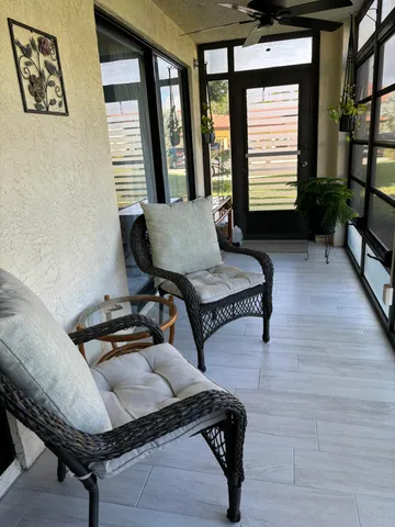 a living room with furniture and a window