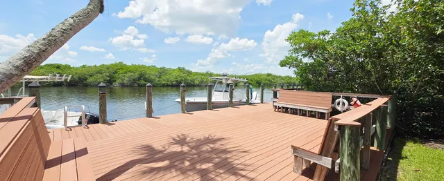 a view of a lake with a house in the background