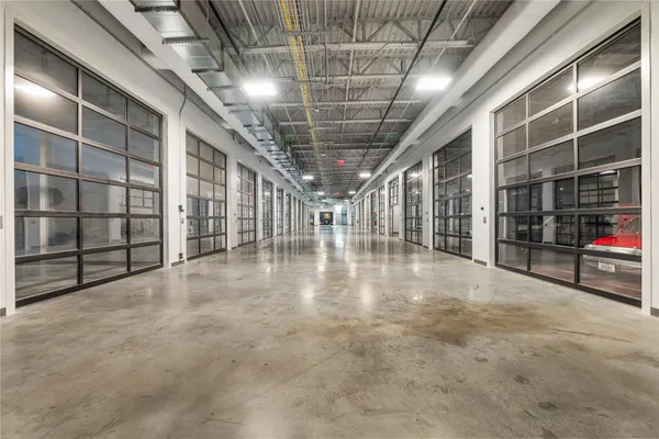 a view of an empty room with wooden shelves